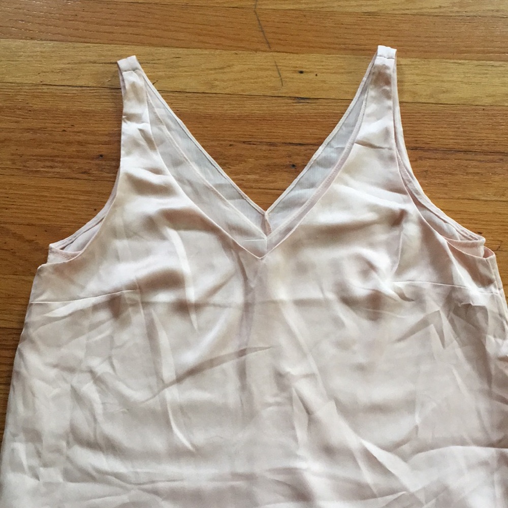 Polyester light cream sleeveless blouse